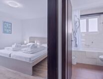 a bedroom with a large mirror
